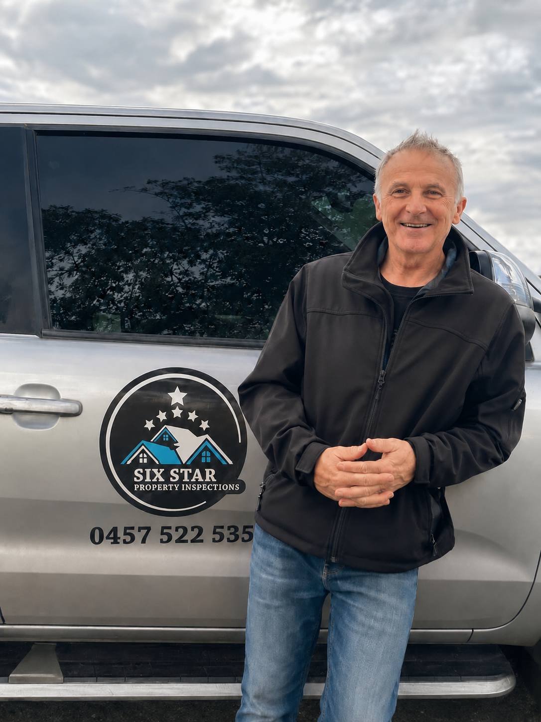 Brett Stephens beside the Six Star Property Inspections vehicle